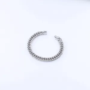 Close-up of a silver Cuban link chain bracelet with a square side-push clasp closure