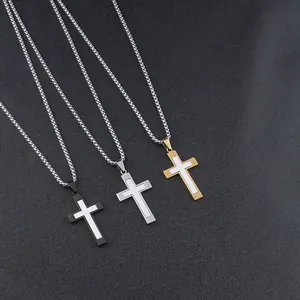 Three men's stainless steel cross necklaces in black, silver, and gold stacked tones