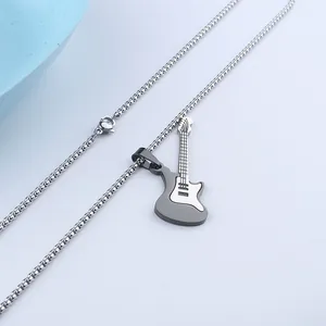 Detailed macro view of a silver guitar pendant on a classic box chain with polished finish