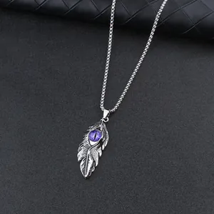 Vintage stainless steel feather necklace featuring a purple evil eye dragon pendant
