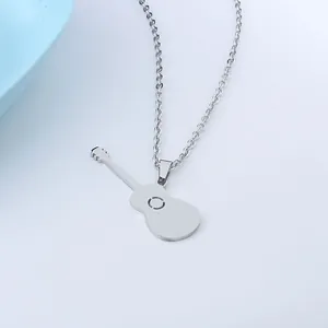 Polished stainless steel guitar pendant necklace with a sleek cross chain over white background