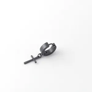 Detail of black matte stainless steel huggie hoop earring with cross dangle for men