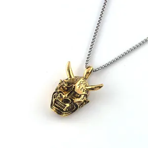 Men's retro gold Hannya mask pendant on stainless steel chain over white background