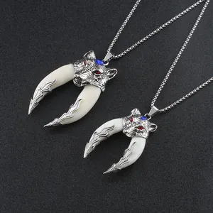 Vintage wolf head necklace with twin tooth pendants and red blue decorative stones