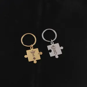 Detail of King and Queen puzzle piece keychains in polished gold and silver finish