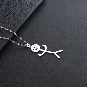 Macro shot of silver stainless steel stickman pendant with funny gesture and box chain