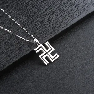 Macro shot of silver anime pendant necklace with polished metal ball chain detail