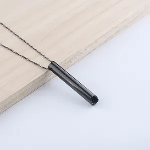 Minimalist mindful breathing necklace with black cylindrical pendant and fine chain