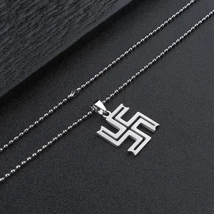 Detailed view of silver stainless steel Manji pendant with round bead chain necklace