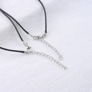 Detail of black wax cord necklace with silver lobster clasp and adjustable chain extender