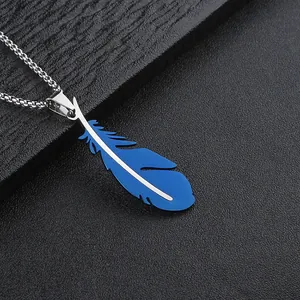 Macro detail of a bright blue stainless steel feather pendant with textured silver edges