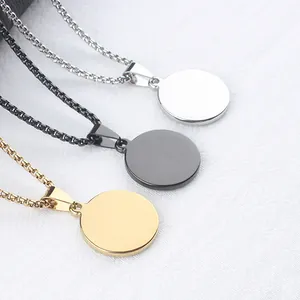 Detailed macro view of three minimalist stainless steel box chains with polished coin pendants