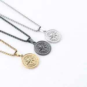 Compass coin pendant necklace set in gold, black, and silver stainless steel finishes