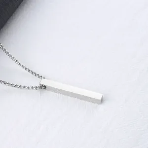 Minimalist silver rectangle bar pendant necklace in stainless steel on white fabric