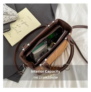 Spacious interior of retro brown suede handbag showing organized storage for essentials