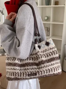 Chic plush tote bag with geometric ethnic pattern and brown faux leather straps