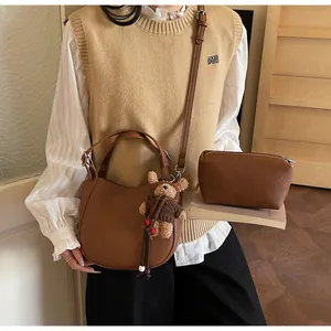 Brown lychee leather bucket bag set with mini pouch and cute bear charm pendant
