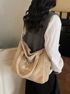 Large beige corduroy tote bag with TOT BAG embroidery and adjustable shoulder strap