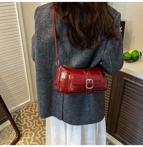 Retro red patent leather baguette bag styled with a grey herringbone coat for women