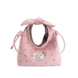 Roze handtas met stippen met strikhandvat en decoratieve knopen voor vrouwen