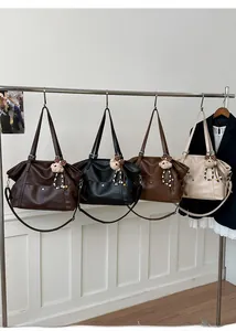 Selection of large faux leather tote bags in four colors with cute plush bear charms
