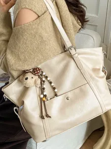 Retro large cream tote bag with bear charm and matte PU leather finish for daily commute