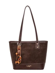 Minimalist deep brown faux suede tote bag with leather straps and metallic accents