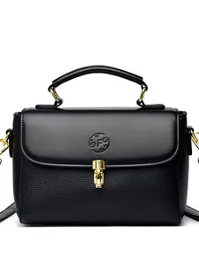 Minimalist black leather baguette bag with gold hardware and embossed F logo