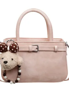 Minimalist pink faux leather bucket bag with cute bow charm and golden metal buckle