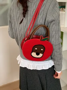 Cute red apple-shaped crossbody bag with puppy embroidery and plush velvet texture