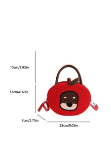 Red apple-shaped plush handbag with cartoon bear embroidery and green leaf detail
