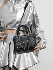Modern black leather handbag with silver studs and braided handle for women