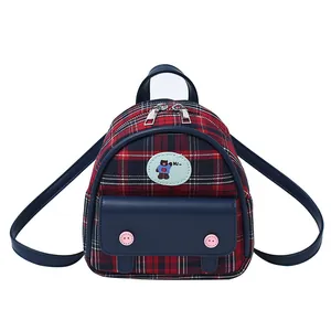 Classic red and blue plaid mini backpack for girls featuring a cute bear patch and front pocket