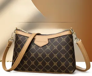 Macro view of vintage quilted patterned crossbody bag with gold metal hooks and texture
