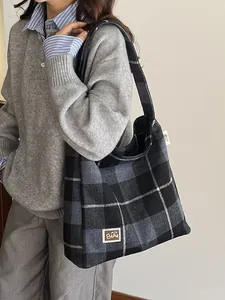 Large plaid tote bag for women featuring grey check pattern and leather brand patch