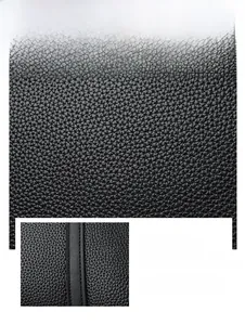 Détail du cuir noir à grain litchi montrant la texture durable et les coutures de précision