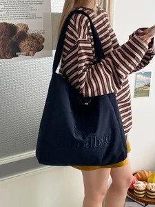 Sac cabas minimaliste en toile bleu marine avec lettres embossées pour le quotidien