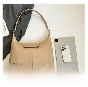 Detailed comparison of beige hobo tote bag capacity with tablet and smartphone devices