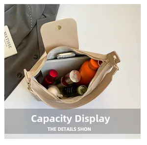 Interior view showing the large capacity of the beige leather tote bag for essentials