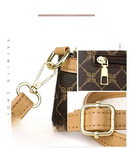 Detail of high-quality golden hardware and luxury monogram pattern on brown crossbody bag