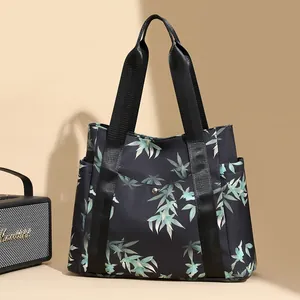 Fashionable nylon tote bag with bamboo leaf print and spacious shoulder straps