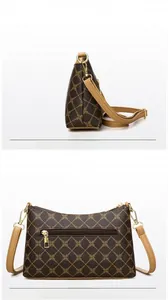 Front and back views of women's crossbody bag with diamond pattern and rear zipper