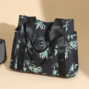 Fashionable tote bag with bamboo leaf print and sturdy black straps for casual daily use