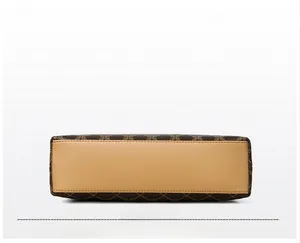 Detailed view of structured handbag base with clean stitching and vintage pattern