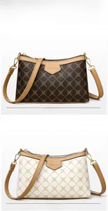 Detail of brown and white crossbody bags with rhombus pattern and gold hardware