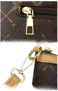 Detail of high-quality gold plating on the zipper pull and shoulder strap hardware