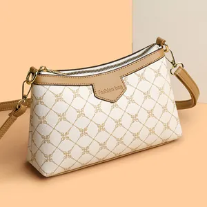 Minimalist beige crossbody bag for women with vintage floral pattern and leather detail