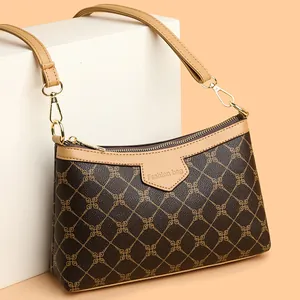 Retro brown monogram crossbody bag for women with adjustable strap in studio lighting