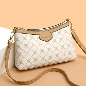 Chic women's shoulder bag in beige with geometric patterns and brown leather trim