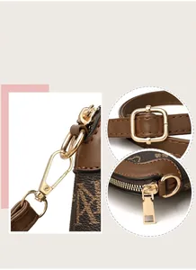 Detailed macro view of high-quality golden metal hardware on a brown monogram purse